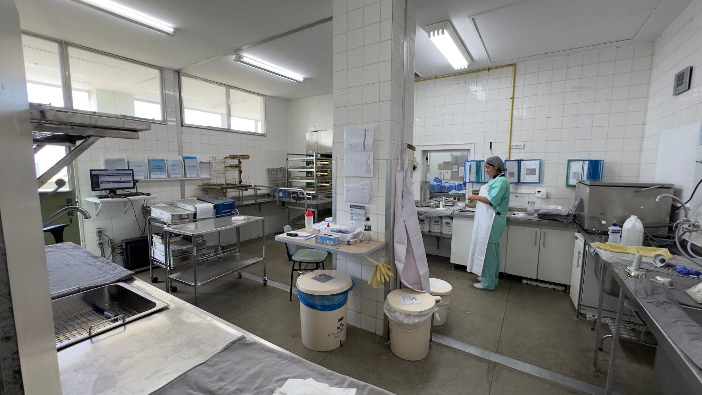 A hospital sterile services room, staff at work.